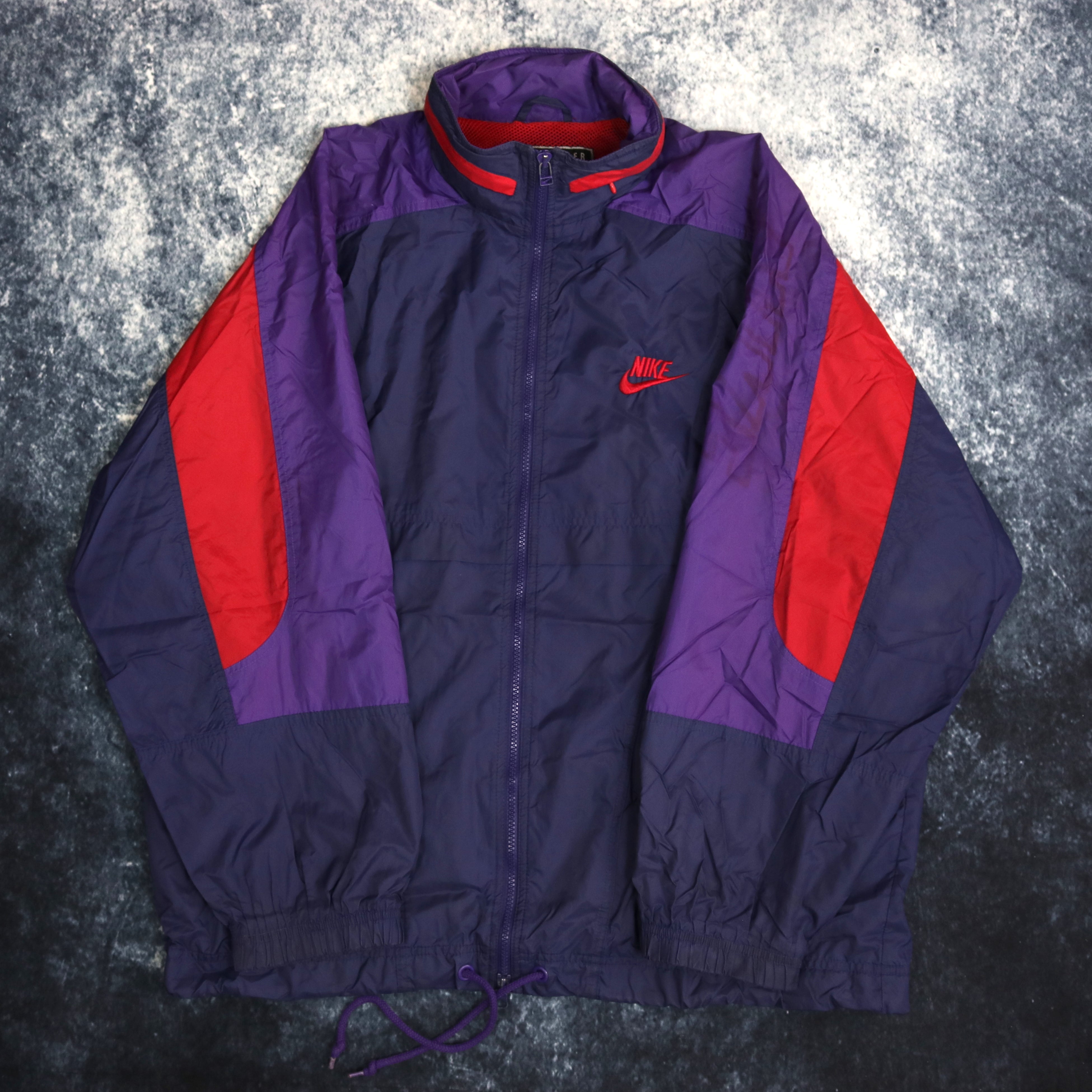 Navy blue and red nike windbreaker top